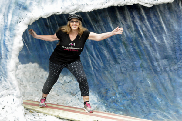 Karen Duquette Surfing in front of Lincoln City Surf Shop